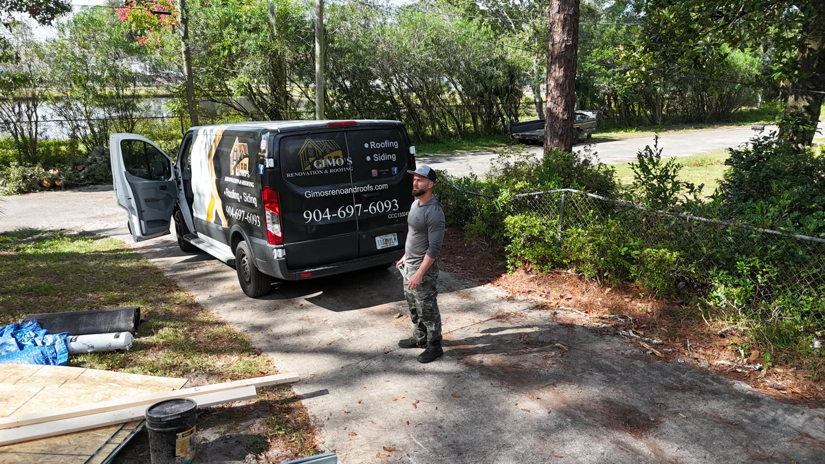 Gimo's Roofing owner with company van